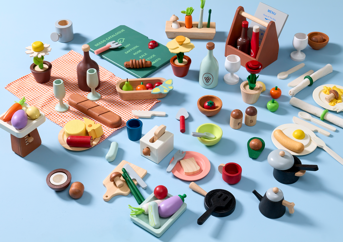 A wooden garden shop playset with various toy plants, pots, gardening tools, and a sign indicating a 'Garden Catalogue'.