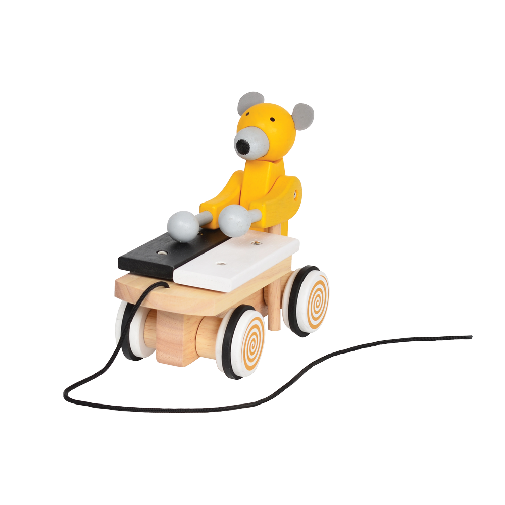 A colorful toy xylophone in the shape of a cartoon bear with yellow body and black hair, attached to a wooden structure resembling a stomach and intestines, on a spiral-patterned base.