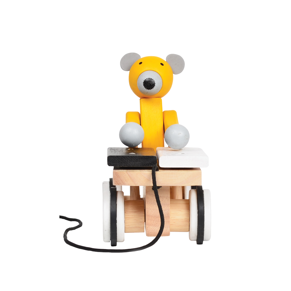 A colorful toy xylophone in the shape of a cartoon bear with yellow body and black hair, attached to a wooden structure resembling a stomach and intestines, on a spiral-patterned base.