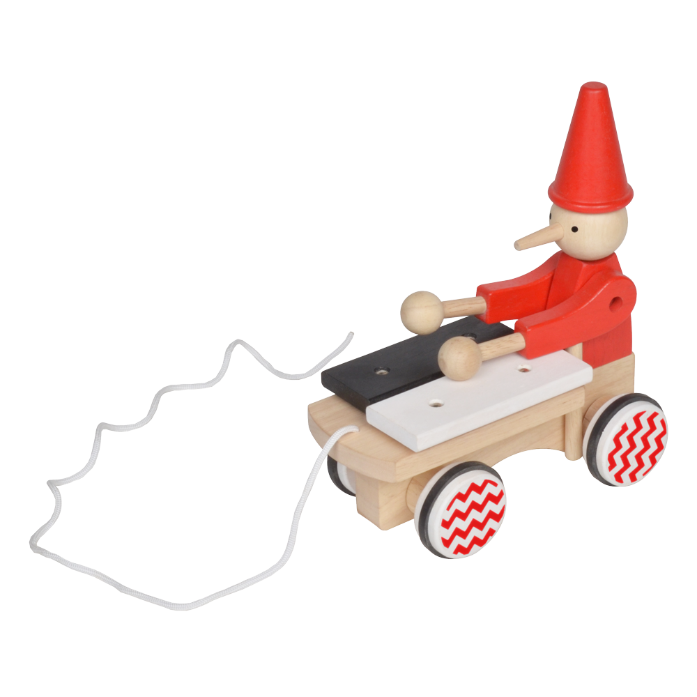 A wooden pull-along toy featuring a character resembling Pinocchio with a red hat, red jacket,  attached to a small wooden xylophone on wheels with a red and white zig-zag pattern.