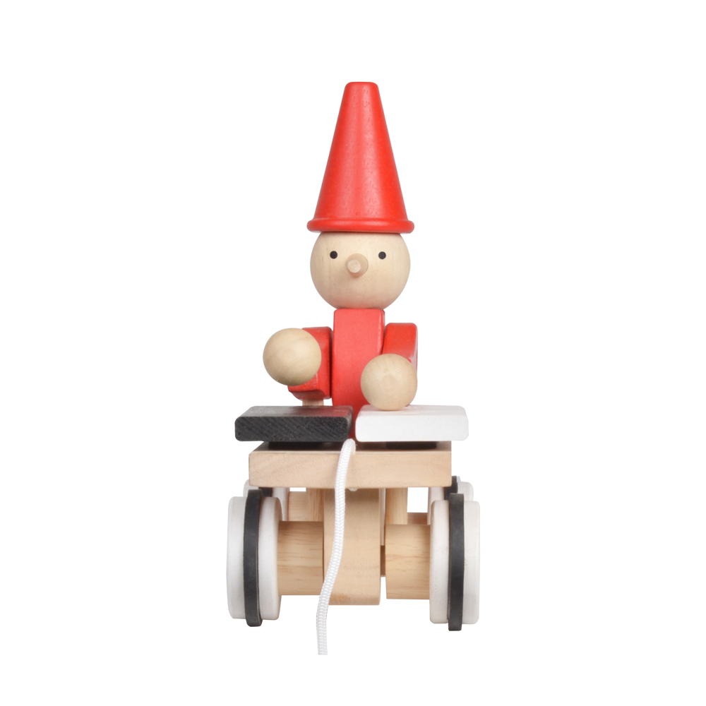 A wooden pull-along toy featuring a character resembling Pinocchio with a red hat, red jacket,  attached to a small wooden xylophone on wheels with a red and white zig-zag pattern.