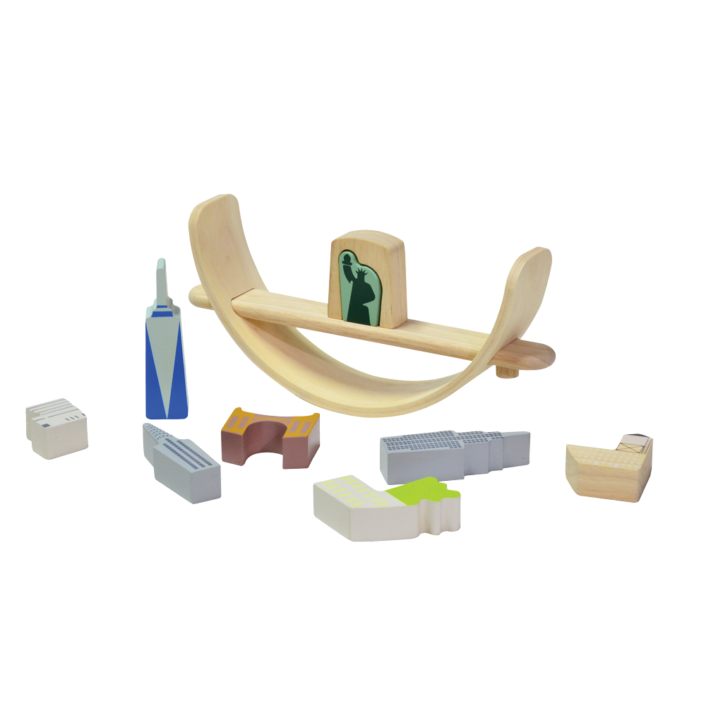 Toys representing New York cityscape arranged on a crescent-shaped base, intended for educational play to promote coordination and social skills.