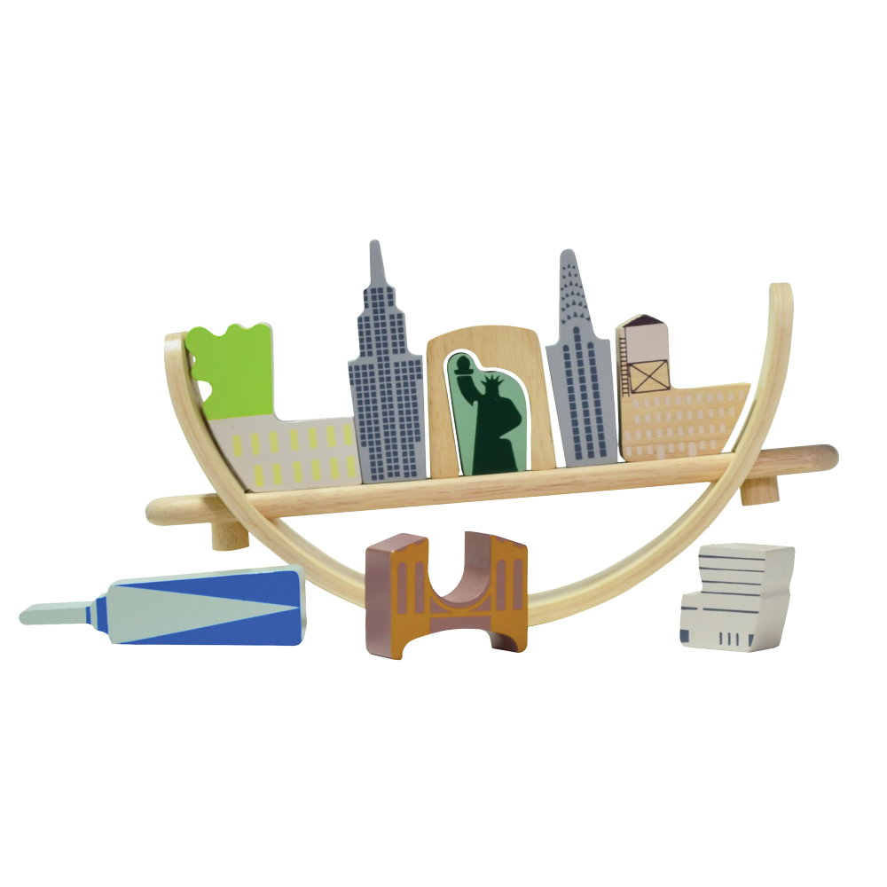 Toys representing New York cityscape arranged on a crescent-shaped base, intended for educational play to promote coordination and social skills.