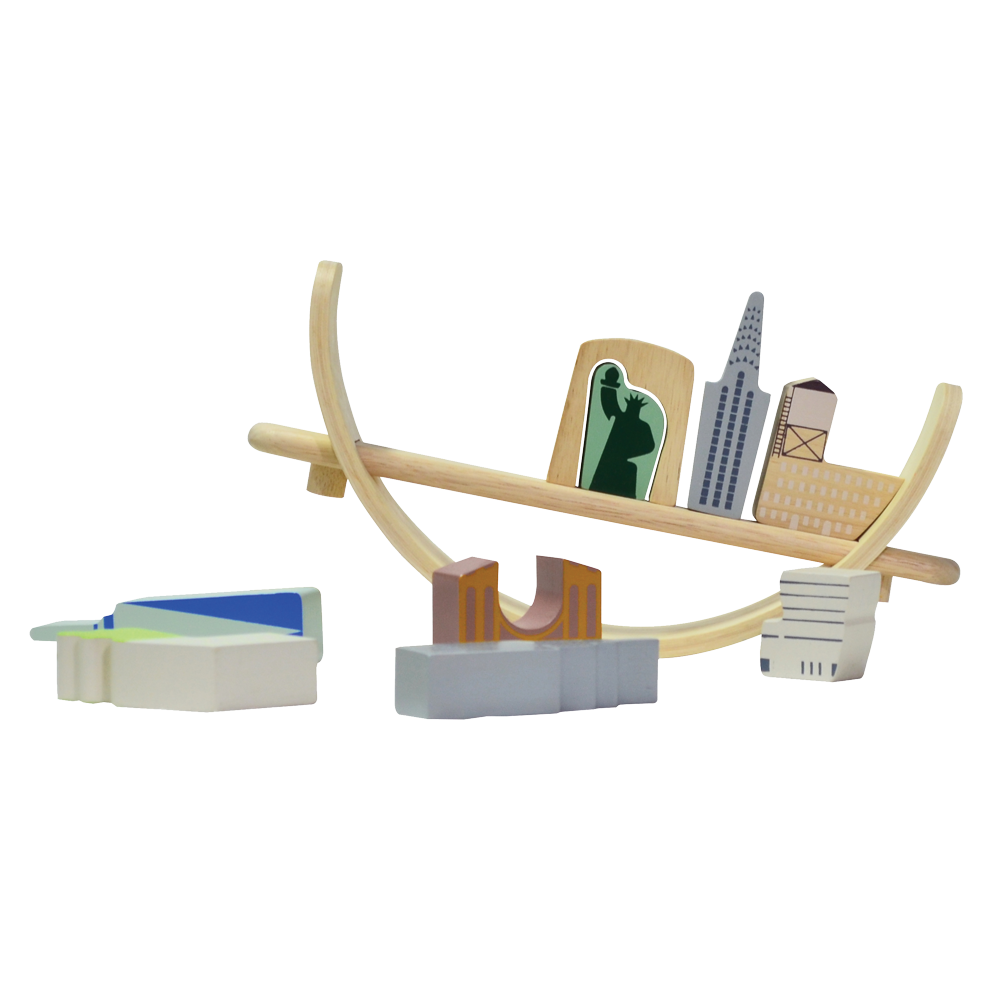 Toys representing New York cityscape arranged on a crescent-shaped base, intended for educational play to promote coordination and social skills.