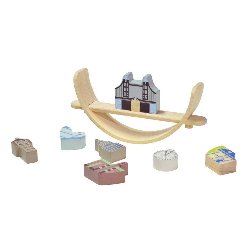 A London cityscape-themed balancing toy featuring famous landmarks. Children can arrange and balance the landmark pieces on a crescent-shaped base that rocks gently with each placement, enhancing coordination and concentration skills.