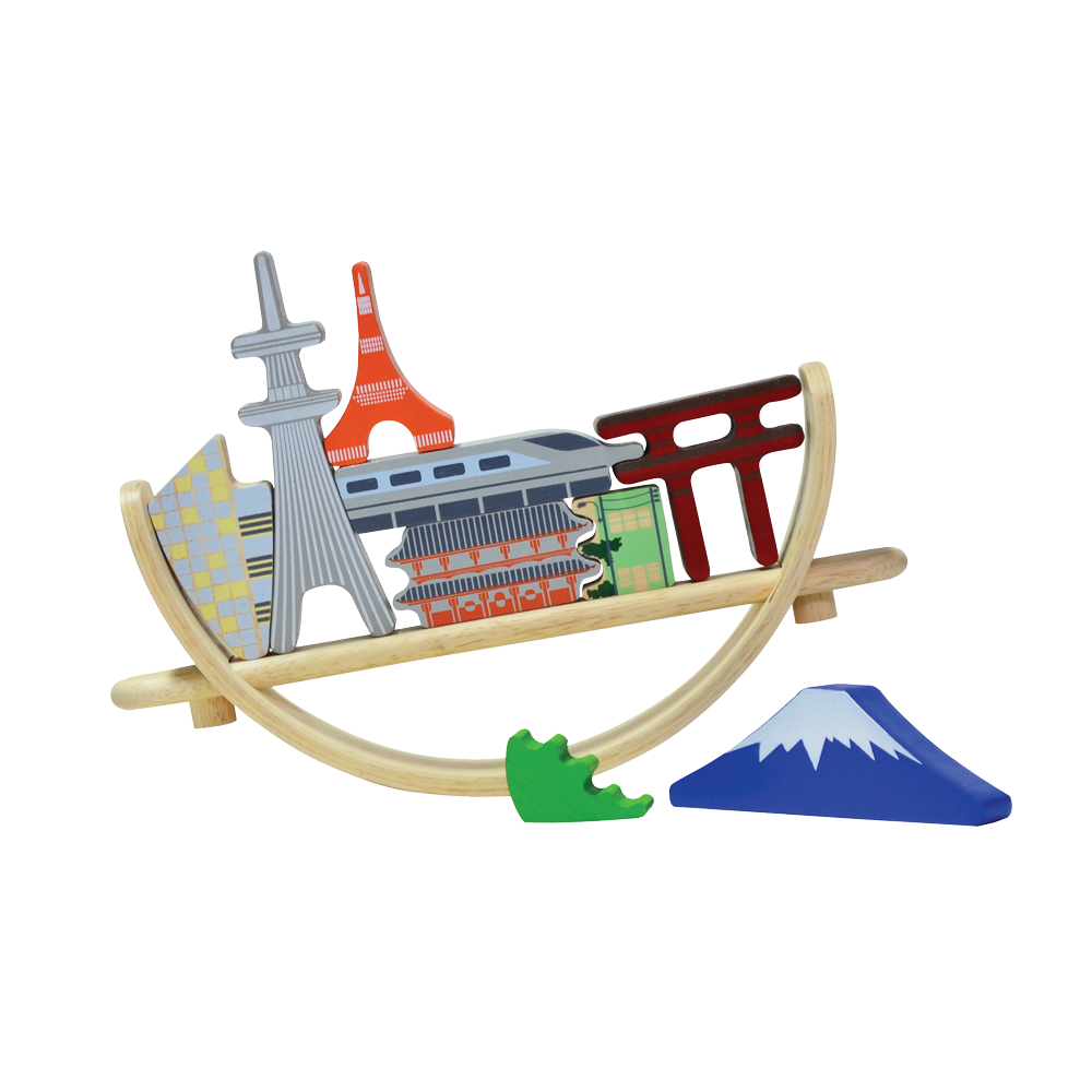 A balancing toy set inspired by the Tokyo cityscape, featuring various iconic landmarks placed on a crescent-shaped base which can rock when touched.