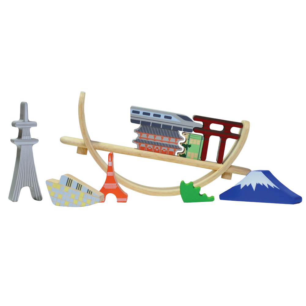 A balancing toy set inspired by the Tokyo cityscape, featuring various iconic landmarks placed on a crescent-shaped base which can rock when touched.