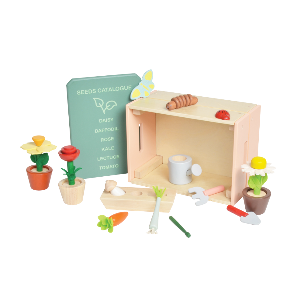 A wooden garden shop playset with various toy plants, pots, gardening tools, and a sign indicating a 'Garden Catalogue'.