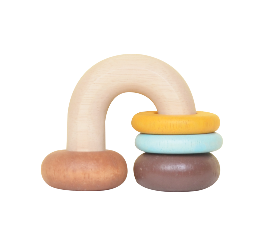 A wooden horse shoe rattle with moving rings in beige, yellow, and brown colors.