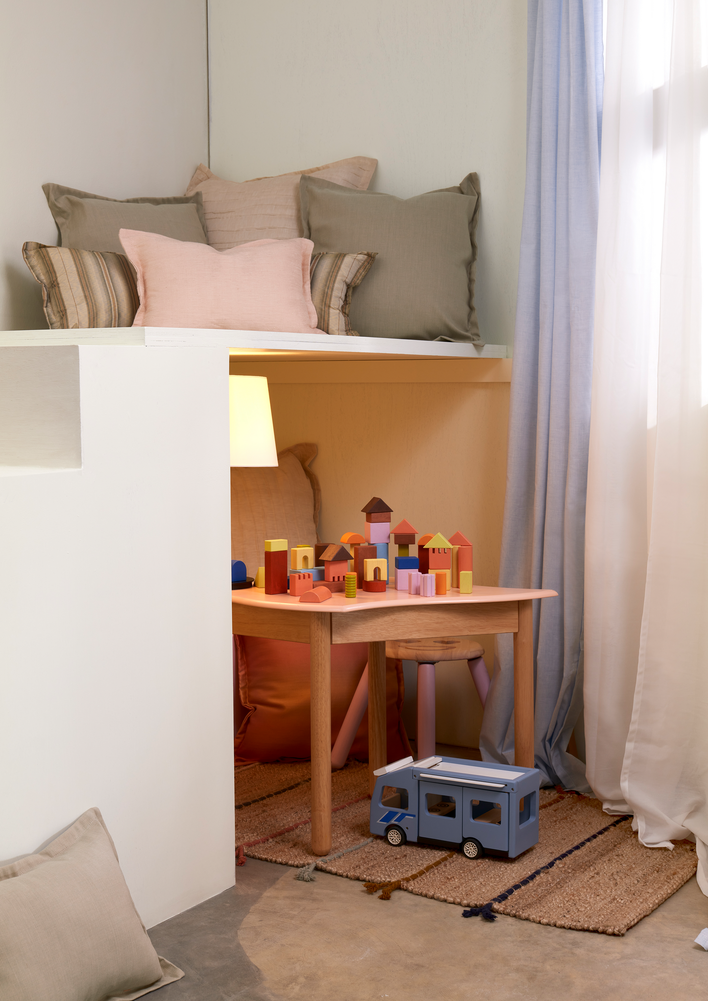 Natural wood unit blocks in cubes, triangles, half-cylinders, columns, and half-circles. Encourages spatial thinking, creativity, and open-ended play.