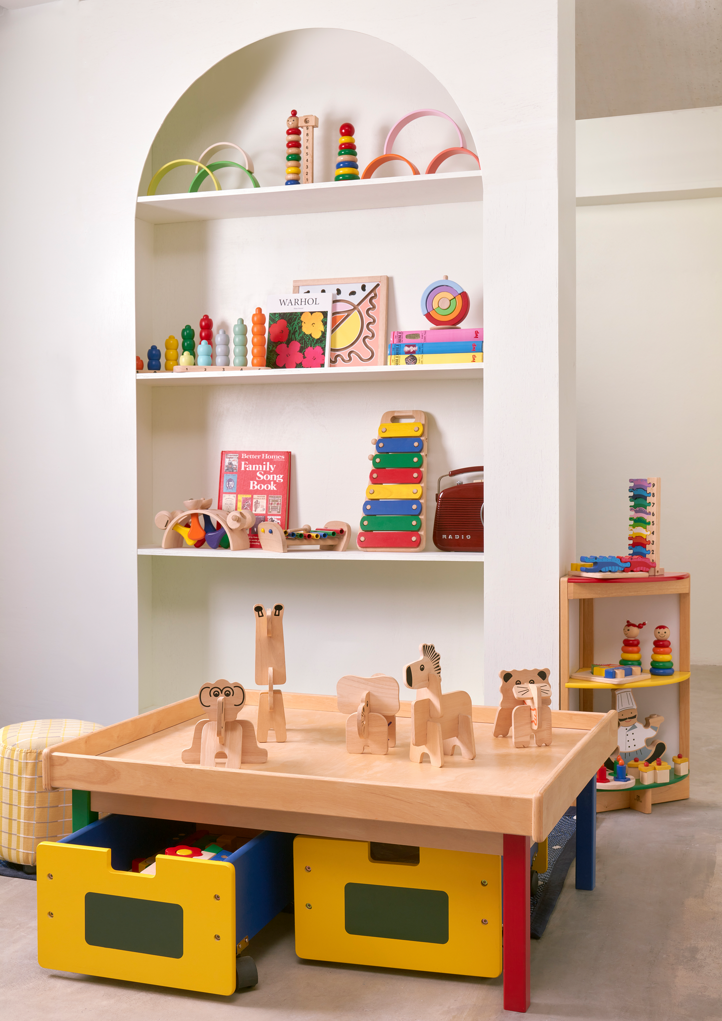 Durable stand holding 6 rhythm instruments: castanet, block drum, jingle bell, jingle stick, clapper, and maracas.