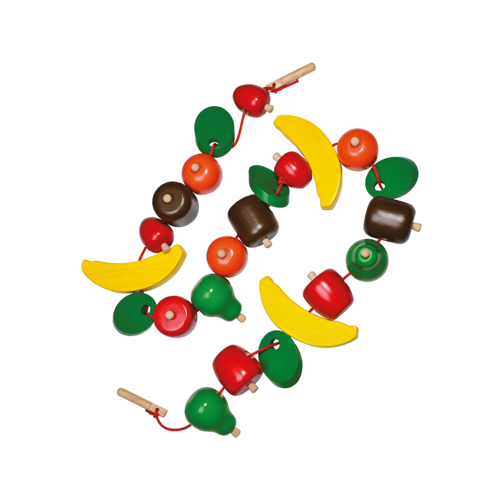 A colorful stringing toy with chunky beads shaped like fruits and a wooden needle, arranged to form a spiral.