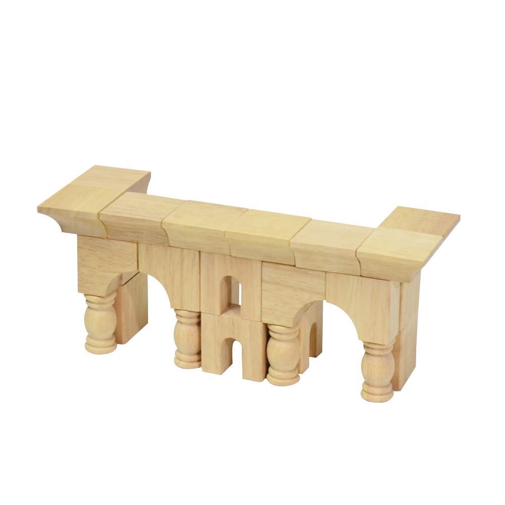 Wooden block construction toy resembling a small mosque with arches and minarets.