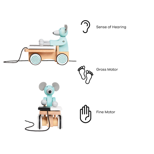 A plush toy xylophone in the shape of a mouse with a blue body, black and white accents, and a wooden xylophone cart with spinning wheels.
