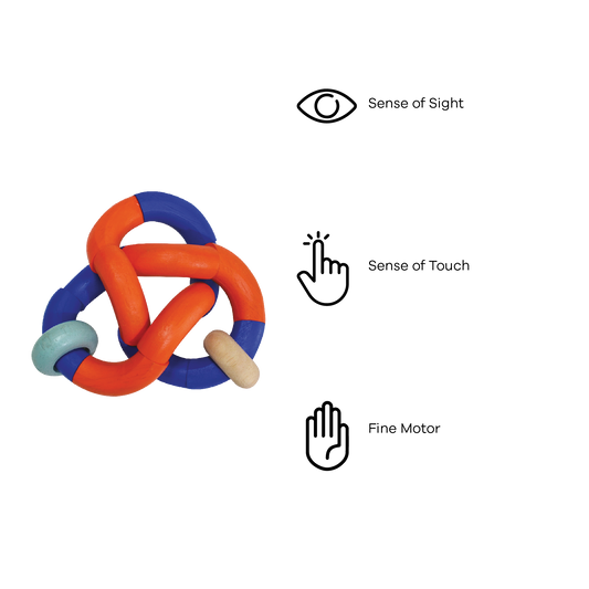 A colorful bendy rattle toy with orange, blue, and green parts connected by knots.