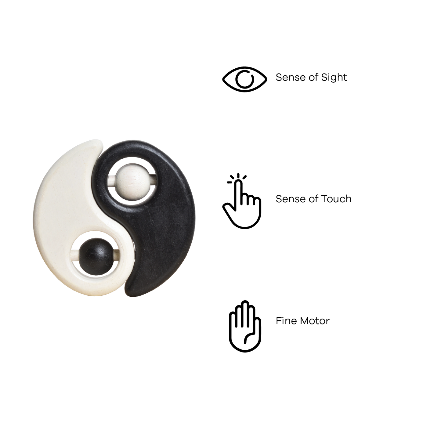 A baby rattle with a white and black color scheme, featuring a spherical shape on one side and a more elongated shape on the other, with a small bead-like object in the center.