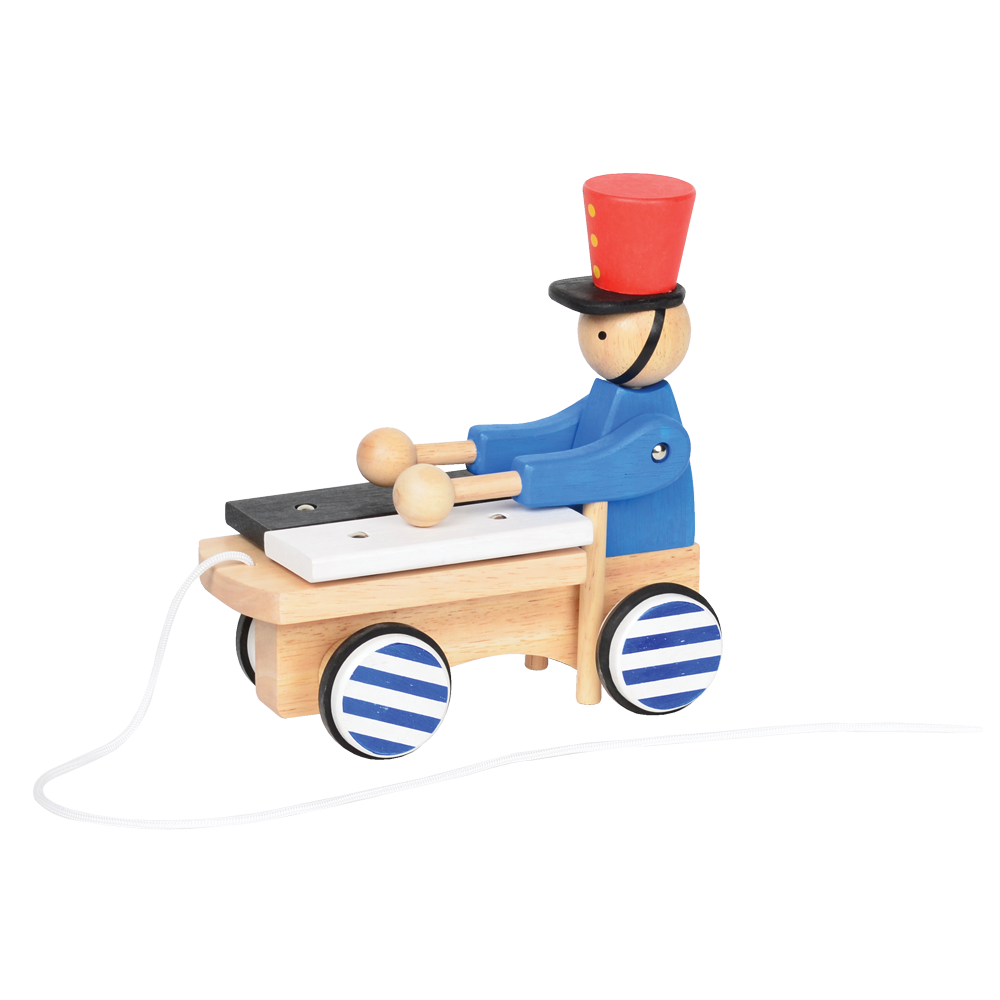 A wooden pull-along toy featuring a character resembling Pinocchio with a red hat, red jacket, attached to a small wooden xylophone on wheels with a red and white zig-zag pattern.